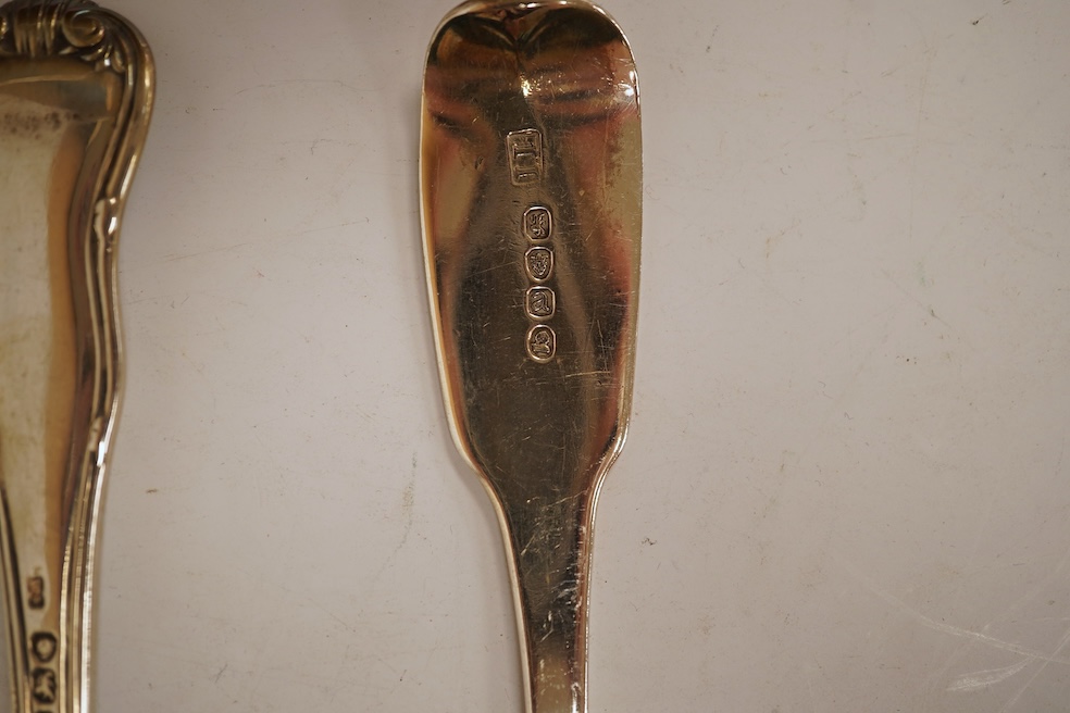 A George III silver fiddle pattern stilton scoop, John Lias, London, 1816, 20cm, together with two Georgian silver sauce ladles, a similar sifter ladle and a William IV shell pattern fish knife, 8.9oz.